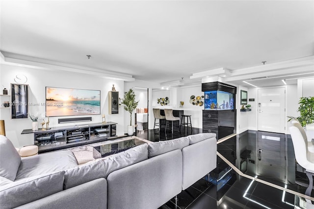 living area featuring granite finish floor