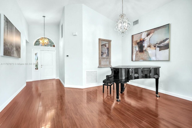 2724 Cayenne Ave, Cooper City, FL 33026 - entrance foyer featuring visible vents, wood finished floors, and a chandelier