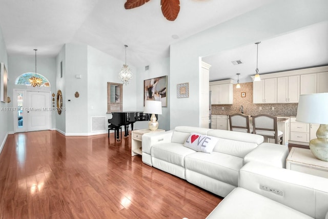 2724 Cayenne Ave, Cooper City, FL 33026 - living area featuring visible vents, baseboards, wood finished floors, and a notable chandelier