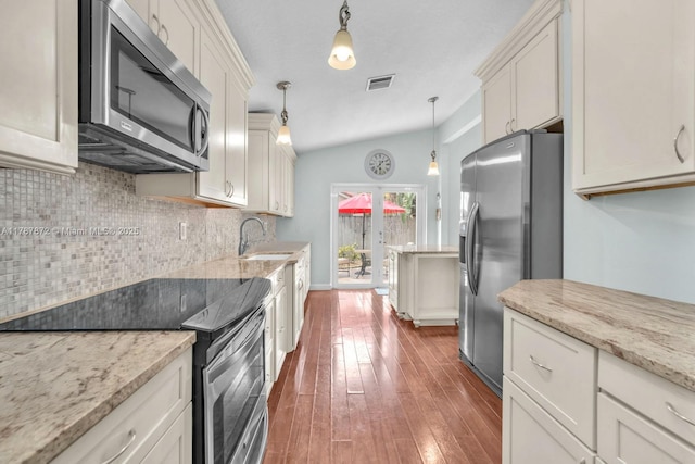 2724 Cayenne Ave, Cooper City, FL 33026 - kitchen with visible vents, decorative backsplash, hardwood / wood-style floors, a sink, and appliances with stainless steel finishes
