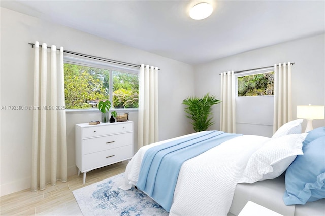 bedroom with light wood-type flooring