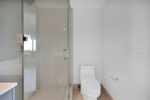 650 NE 32nd St Unit 1004, Miami, FL 33137 - bathroom with vanity, toilet, tile patterned floors, and a stall shower