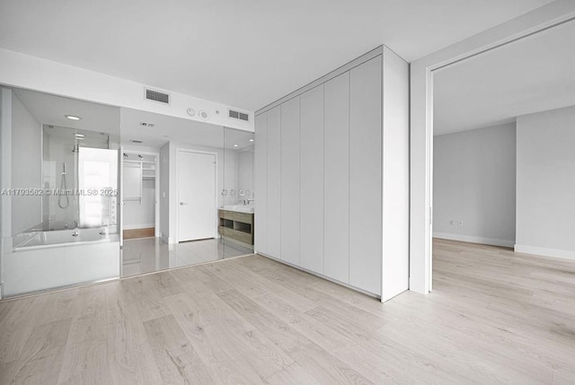 650 NE 32nd St Unit 1004, Miami, FL 33137 - unfurnished bedroom featuring visible vents, baseboards, and wood finished floors