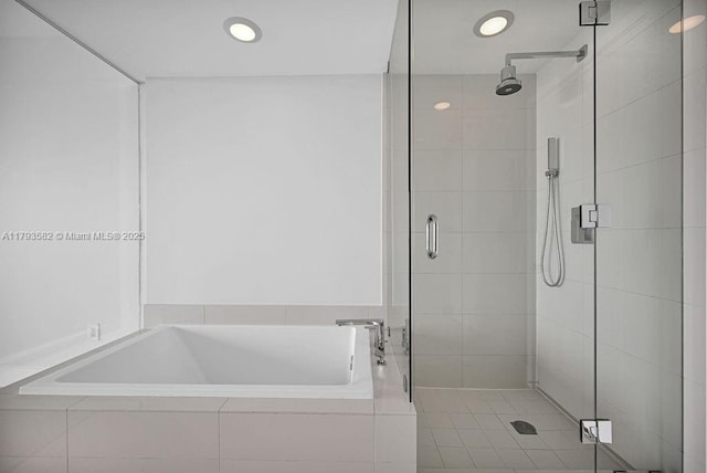 650 NE 32nd St Unit 1004, Miami, FL 33137 - bathroom featuring recessed lighting, a shower stall, and a garden tub
