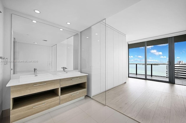 650 NE 32nd St Unit 1004, Miami, FL 33137 - full bath with recessed lighting, expansive windows, tile patterned flooring, and vanity