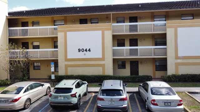 9044 NW 28th Dr Unit 3-202, Coral Springs, FL 33065 - view of building exterior with uncovered parking