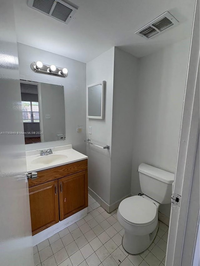 9044 NW 28th Dr Unit 3-202, Coral Springs, FL 33065 - bathroom featuring toilet, tile patterned floors, vanity, and baseboards