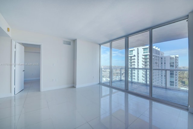 1861 NW S River Dr Unit 1903, Miami, FL 33125 - tiled spare room with a view of city, baseboards, floor to ceiling windows, and visible vents