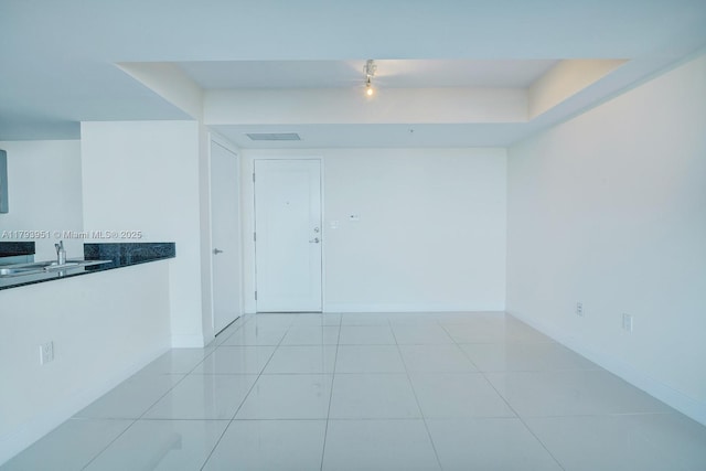 1861 NW S River Dr Unit 1903, Miami, FL 33125 - spare room featuring baseboards, visible vents, track lighting, and a sink