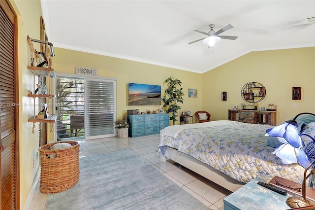 tiled bedroom with ornamental molding, a ceiling fan, and lofted ceiling