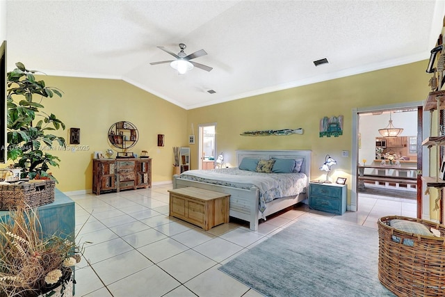 bedroom featuring ornamental molding, light tile patterned flooring, a textured ceiling, a ceiling fan, and vaulted ceiling