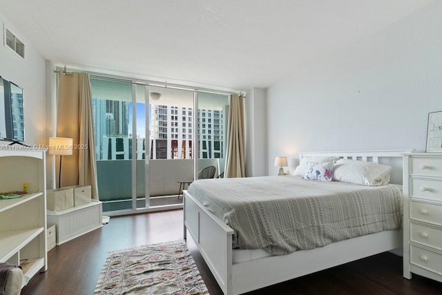 500 NE 29th St Unit 606, Miami, FL 33137 - bedroom with visible vents, wood finished floors, and access to outside