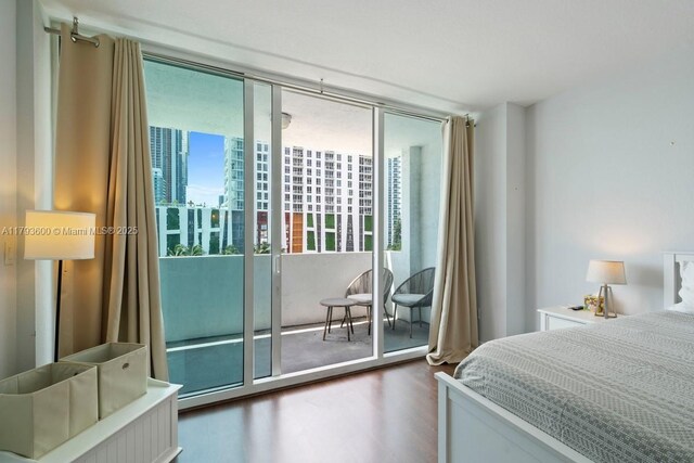 500 NE 29th St Unit 606, Miami, FL 33137 - bedroom with access to outside and wood finished floors