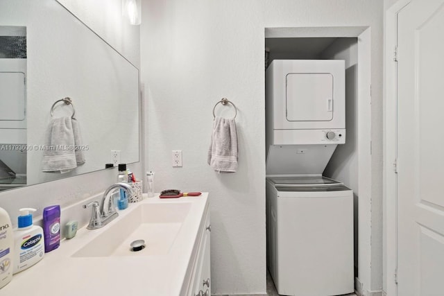 500 NE 29th St Unit 606, Miami, FL 33137 - bathroom featuring vanity and stacked washer and dryer