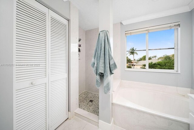 721 Tanglewood Cir, Weston, FL 33327 - full bathroom featuring a stall shower, a bath, and a closet
