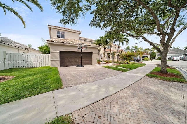 721 Tanglewood Cir, Weston, FL 33327 - mediterranean / spanish-style house featuring fence, a front yard, decorative driveway, stucco siding, and a tile roof