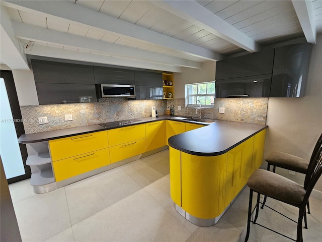 12120 NE 11th Pl, North Miami, FL 33161 - kitchen featuring decorative backsplash, open shelves, a sink, stainless steel microwave, and a peninsula