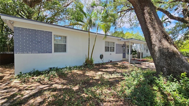 12120 NE 11th Pl, North Miami, FL 33161 - view of front of home featuring brick siding and stucco siding