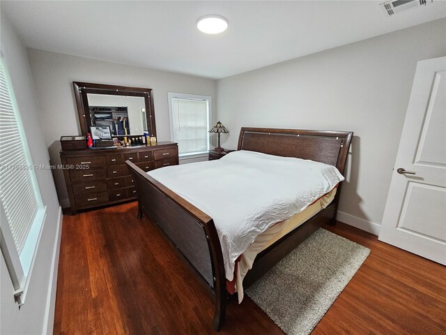 12120 NE 11th Pl, North Miami, FL 33161 - bedroom with baseboards, visible vents, and dark wood-type flooring
