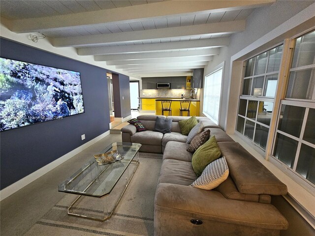 12120 NE 11th Pl, North Miami, FL 33161 - home theater room featuring baseboards and beamed ceiling
