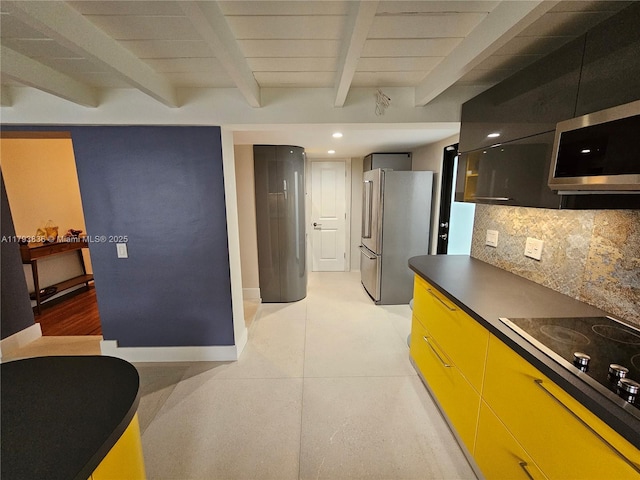 kitchen with dark countertops, tasteful backsplash, baseboards, beamed ceiling, and stainless steel appliances