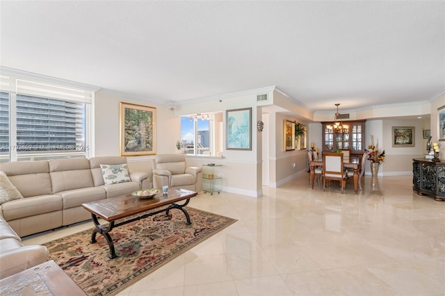 living area with crown molding, a wealth of natural light, visible vents, and a notable chandelier