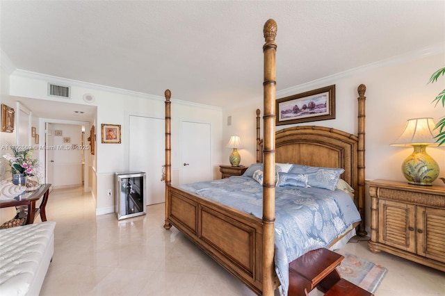 bedroom featuring visible vents and ornamental molding