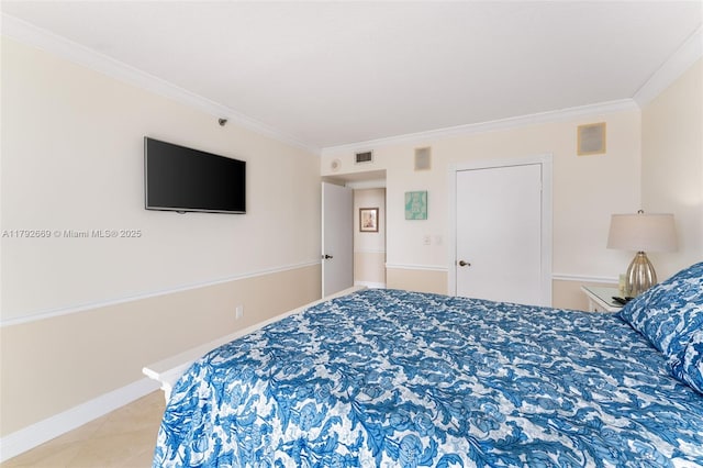 bedroom with visible vents, baseboards, and crown molding