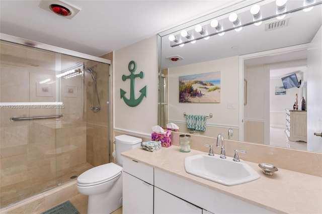 full bath featuring vanity, toilet, visible vents, and a stall shower