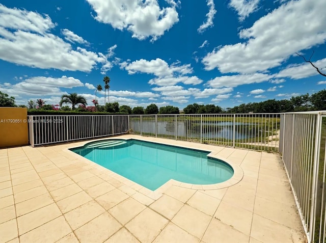 view of pool with a fenced in pool, a patio, a water view, and a fenced backyard
