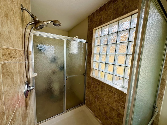 bathroom featuring a shower stall