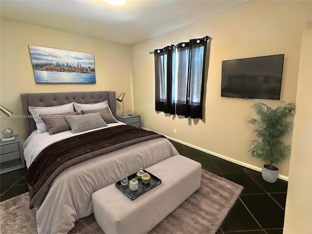 bedroom featuring baseboards and tile patterned flooring