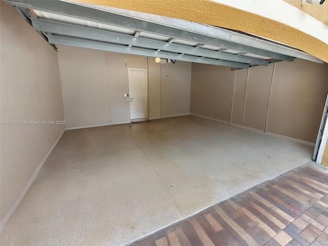 garage featuring baseboards