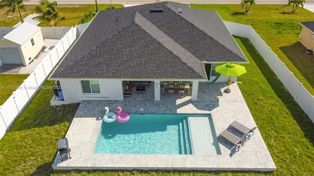 view of swimming pool with a fenced backyard and a patio area