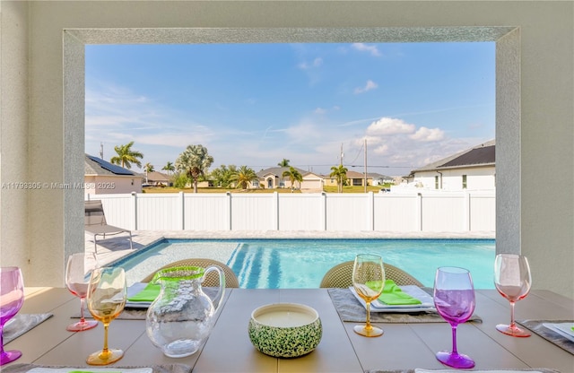view of swimming pool with fence and a fenced in pool