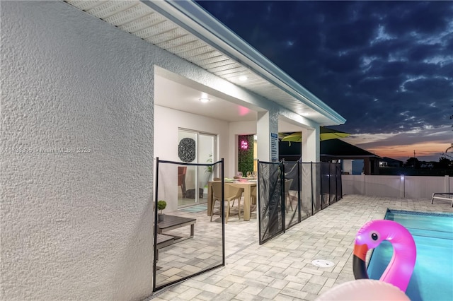 exterior space featuring a fenced in pool and fence