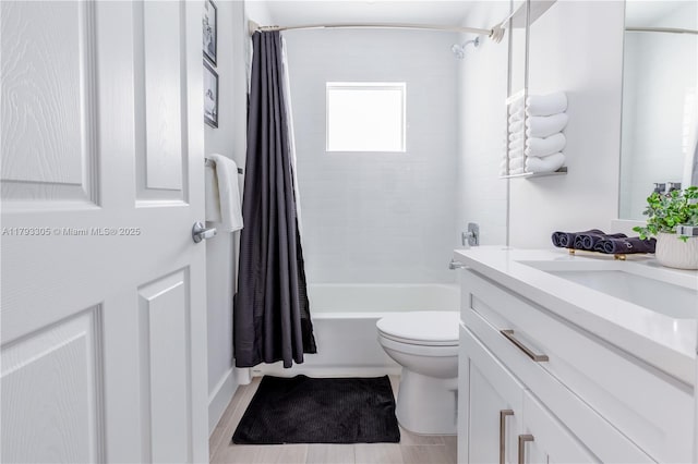 bathroom with vanity, toilet, and shower / tub combo