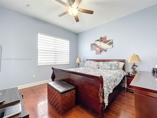 bedroom with baseboards, a ceiling fan, and wood finished floors