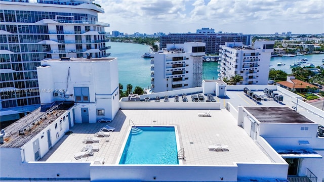aerial view featuring a view of city and a water view