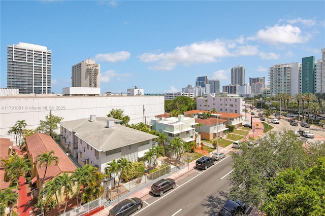 birds eye view of property with a view of city