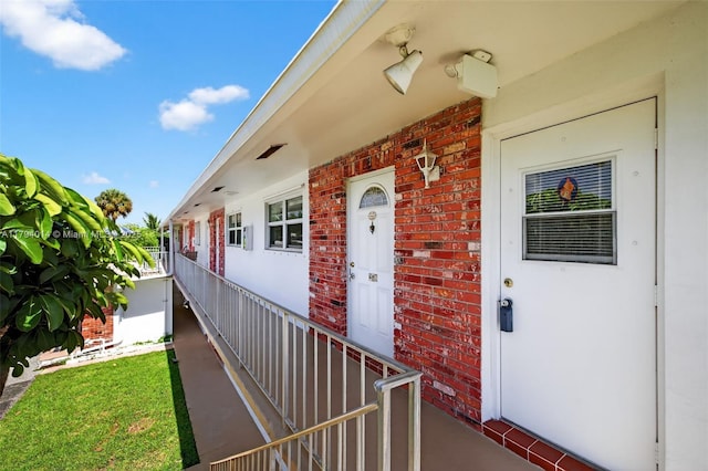 401 S Golf Blvd Unit 270, Pompano Beach, FL 33064 - view of exterior entry featuring brick siding