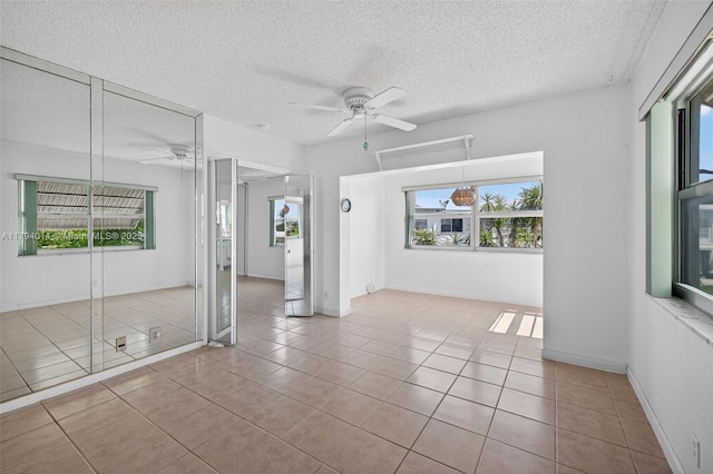 401 S Golf Blvd Unit 270, Pompano Beach, FL 33064 - tiled spare room with a ceiling fan, plenty of natural light, and a textured ceiling