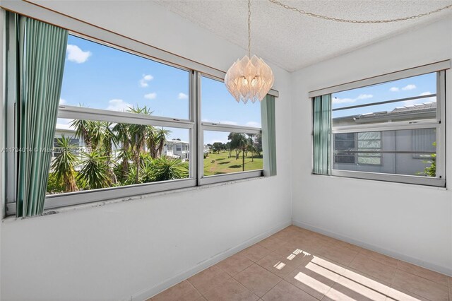 401 S Golf Blvd Unit 270, Pompano Beach, FL 33064 - unfurnished sunroom with a chandelier