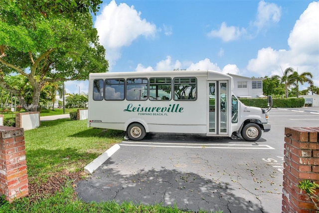 401 S Golf Blvd Unit 270, Pompano Beach, FL 33064 - community sign with uncovered parking and a yard