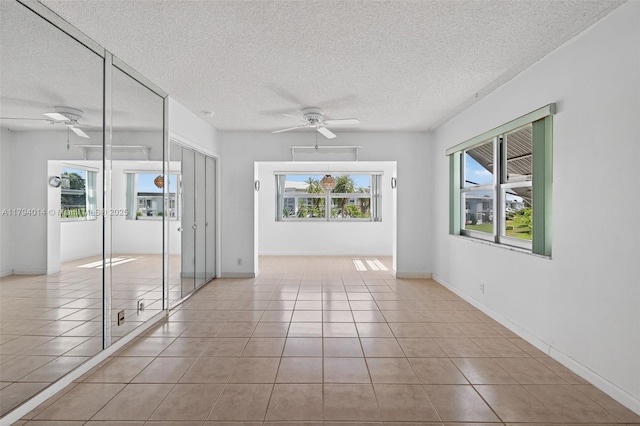 401 S Golf Blvd Unit 270, Pompano Beach, FL 33064 - tiled empty room with ceiling fan and a textured ceiling