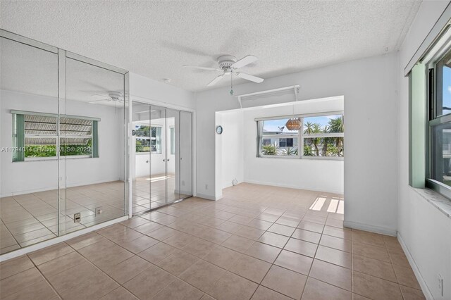 401 S Golf Blvd Unit 270, Pompano Beach, FL 33064 - unfurnished room featuring a ceiling fan, tile patterned flooring, and a textured ceiling