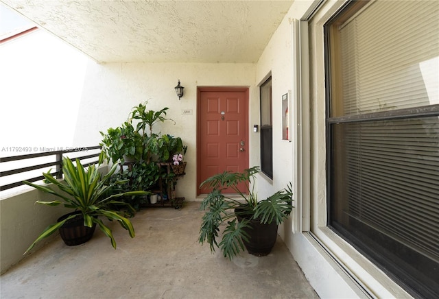 1100 N Hiatus Rd Unit 1100, Pembroke Pines, FL 33026 - view of exterior entry featuring a balcony and stucco siding
