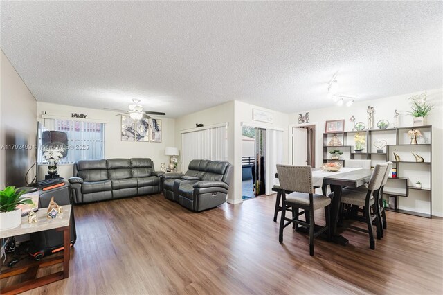 1100 N Hiatus Rd Unit 1100, Pembroke Pines, FL 33026 - living room featuring a textured ceiling and wood finished floors