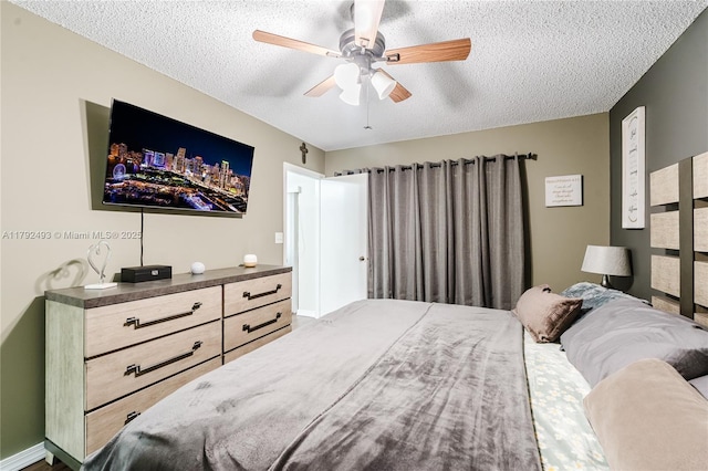 1100 N Hiatus Rd Unit 1100, Pembroke Pines, FL 33026 - bedroom featuring a ceiling fan and a textured ceiling