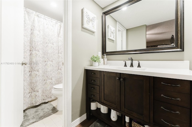 1100 N Hiatus Rd Unit 1100, Pembroke Pines, FL 33026 - bathroom with toilet, baseboards, tile patterned flooring, and vanity